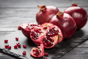 Red,Juice,Pomegranate,On,Dark,Background